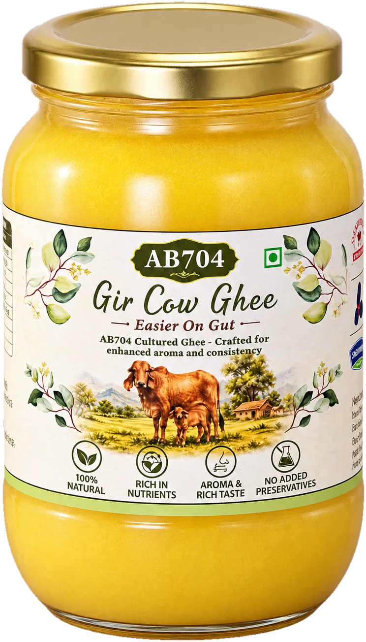 A jar of AB704 Cultured A2 Gir Cow Ghee with a gold lid